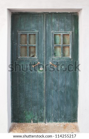 Old green door on the streets of Portugal.