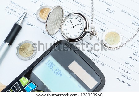 Calculator, pocket watches, money against bank calculations.