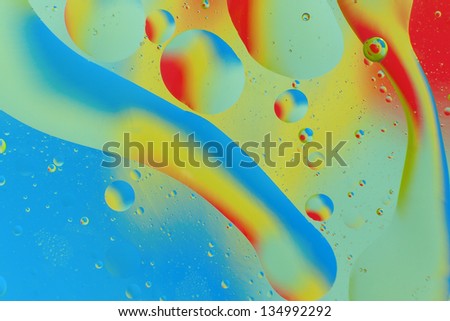 Decorative circles form of oil on a colorful background. abstraction.