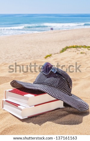 Panama for the sun and reading books on the beach against the sea. Sunglasses.