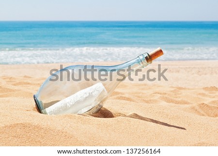 A Bottle With A Letter Of Distress On The Beach. Summer.