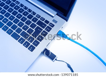 Network cable to connect the network to the laptop and usb pen drive. View from above in blue.