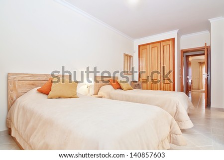 Classic room with a toilet and a bedroom wardrobe. In the warm colors.