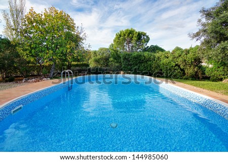 Luxury summer swimming pool. For relaxation and swimming. Summer.