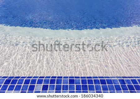 Mosaic tiles in the pool with water. The hotel for swimming and recreation.