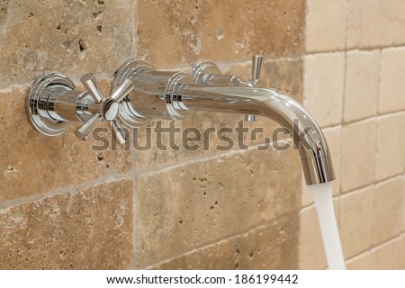 Water flows from the tap. Waste of money.
