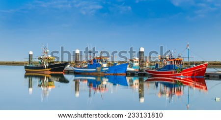 Fishing boats moored at the dock. Industrial ships. Portugal.