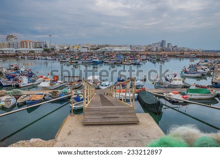 Seaport berth for ships. Fish industry in Portugal. Quarteira.
