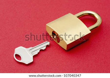 Padlock on red background.