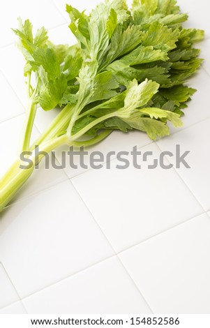 The celery on tile floor