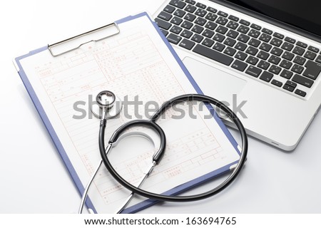 Laptop and stethoscope and medical records, medical concept