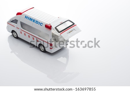 Ambulance miniature car on white background
