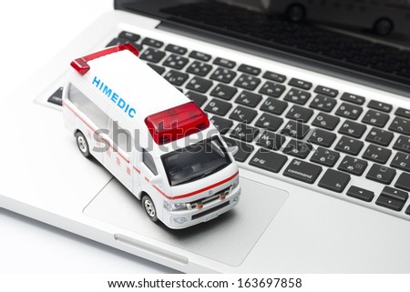 Ambulance miniature car and notebook pc