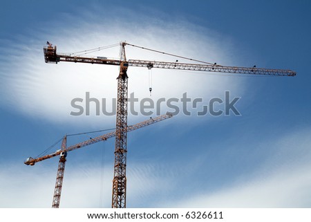 Tower crane reaching to the clouds.