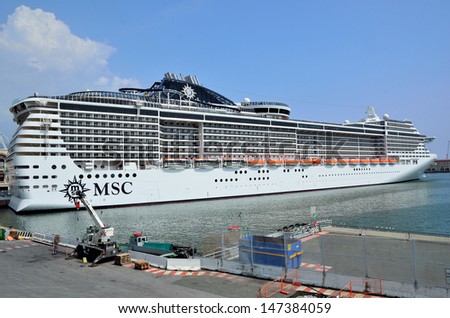 GENOA, ITALY - JULY 13: the majestic new flagship MSC cruise liner (Preziosa) leaves the port of Genoa for the first cruise july 13 2013, Genoa, Italy