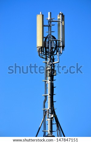 cellular communications tower in the blue sky