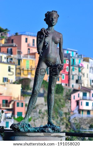 MANAROLA, LA SPEZIA, ITALY,APRIL 26, the woman grape, bronze statue by Antonio Puja, Argentine sculptor- April 26 2014, manarola, la spezia, Italy