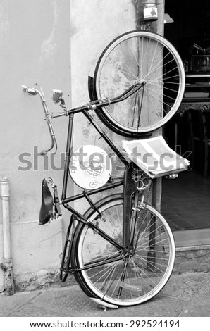LUCCA, ITALY JUNE 28 old bicycle at the entrance of a typical restaurant in the old townJune 28 2015, Lucca Italy