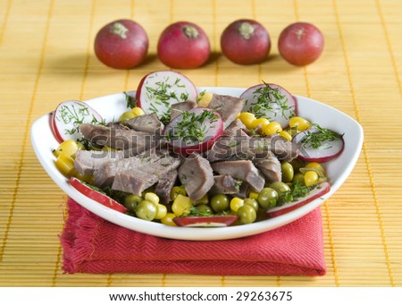 Salad from a beef tongue with radish