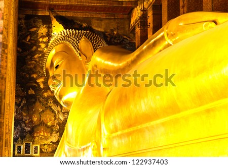 BANGKOK, THAILAND - DEC 22: Details of the Reclining Buddha statue at the Wat Pho temple on December 22, 2012 in Wat Pho temple, Bangkok,Thailand. The reclining Buddha is 15m high and 43m long.
