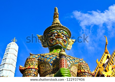 BANGKOK THAILAND - DEC 22 : Demon statue on Grand Palace or Temple of the Emerald Buddha (also called Wat Phra Kaew) on December 22, 2012 in Bangkok, Thailand.