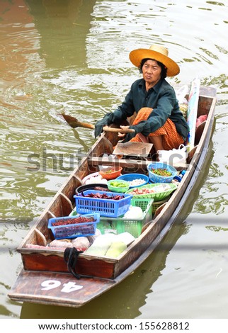 SAMUT SONGKHRAM, THAILAND - SEP 21:Local merchant sell food ,fruits and product at Thaka floating market,on September 21,2013 in Samutsongkhram,Thailand. Thaka is a popular tourist attraction.
