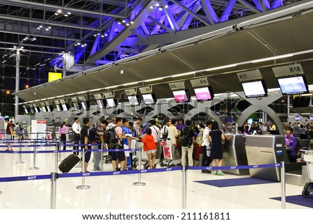 BANGKOK - AUGUST 15 : People waiting in check-in line K terminal of the Bangkok airport on August 15, 2014. Suvarnabhumi airport is world\'s 4th largest single-building airport terminal.