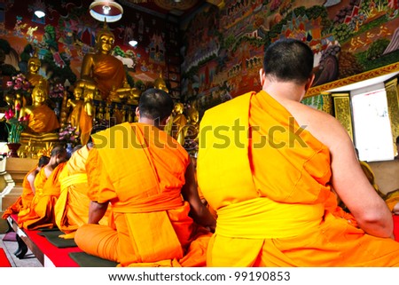 Monks prayed in the old temple ,Bangkok,Thailand.