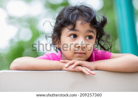 Outdoor Portrait of a Thoughtful LIttle Girl
