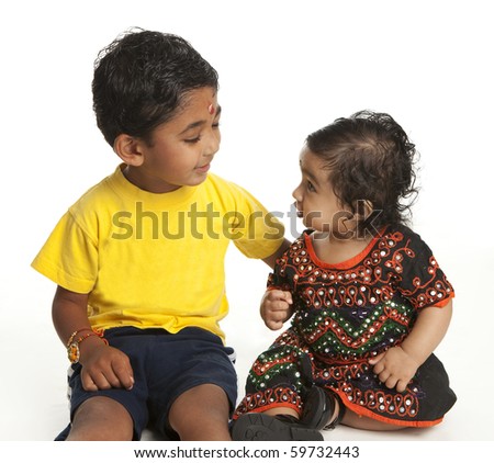 Asian Indian Brother and Sister at the Traditional Hindu Festival of Rakshabandhan on White