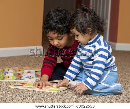 Preschooler showing Baby Sister Number and Shapes Puzzle