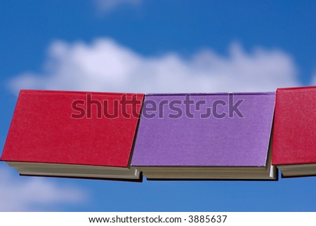 Books displayed with the blue sky in deep.