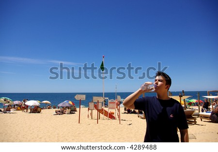 To drink water in the beach in very hot day.