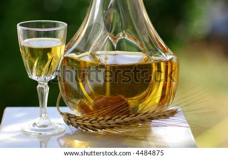 bottle and glass with burning hot water of fig.