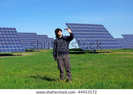 Young man near the central photovoltaic.