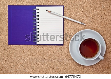 purple notebook on cork board