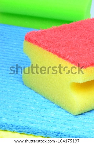 A close up of a dish washing sponge on cloths