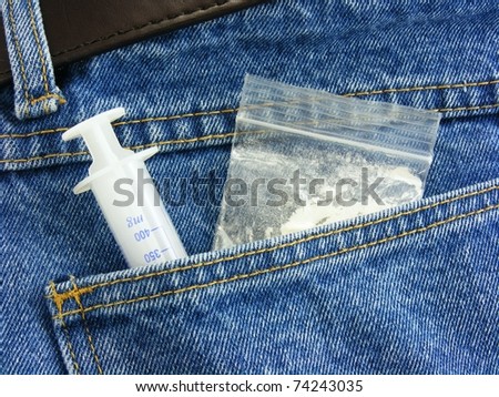 Drugs & hypodermic needle in back pocket of denim jeans