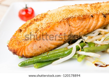 grilled salmon and tomato - french cuisine dish with tomato and salmon