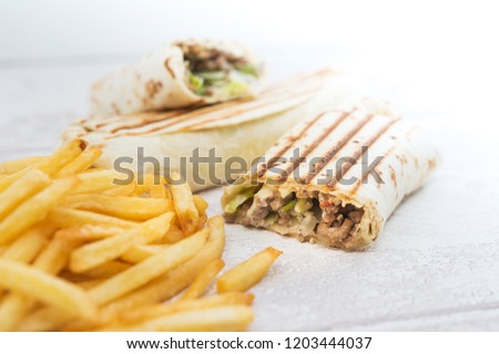 beef tacos served with golden French fries