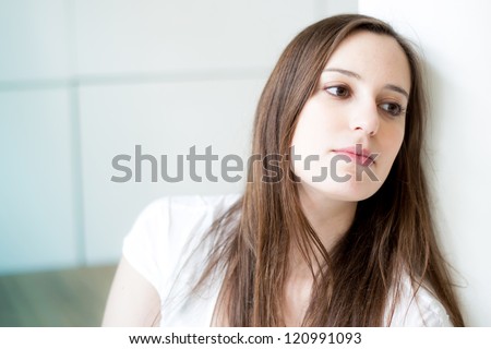indoor portrait of a thinking woman