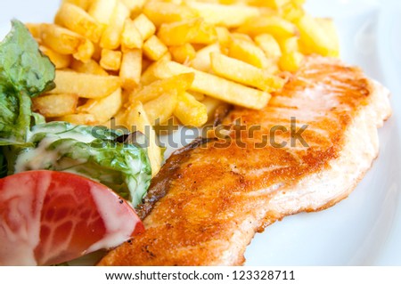 grilled salmon and tomato - french cuisine dish with tomato and salmon