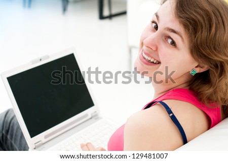 young woman sitting comfortable with laptop on couch
