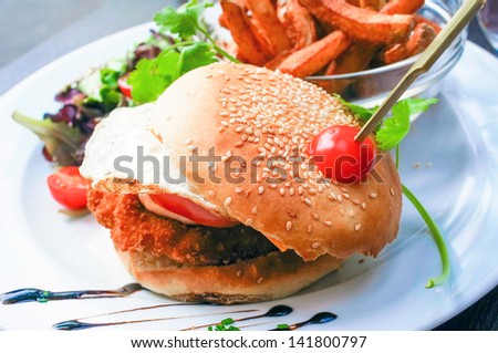American cheese chicken burger with fresh salad
