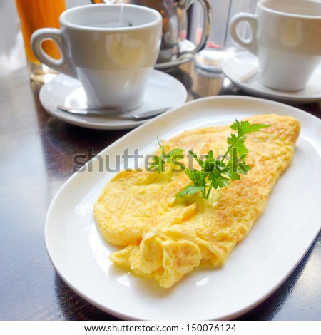 omelet with orange juice and green salad