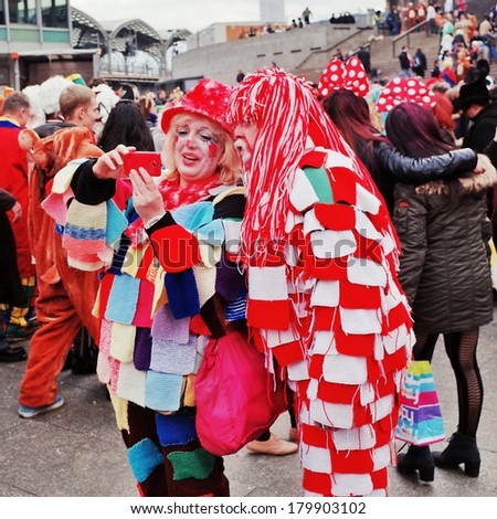 Cologne,North Rhine-March 3 : Use camera to take pictures.more than one million spectators on the streets.Carnival parade on March 3, 2014 in Cologne,Germany.