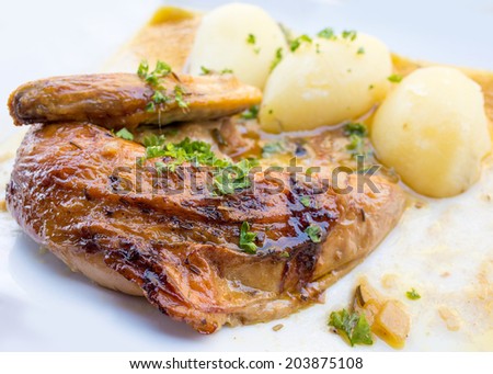 delicious Chicken with sauce and golden potatoes
