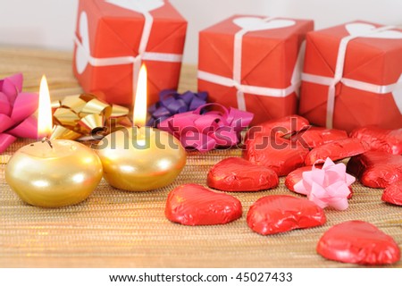Red gift box with white candle placed beside-ideal for your valentine\'s background.