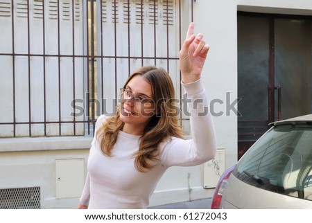 Outdoor portrait young woman Calling taxi