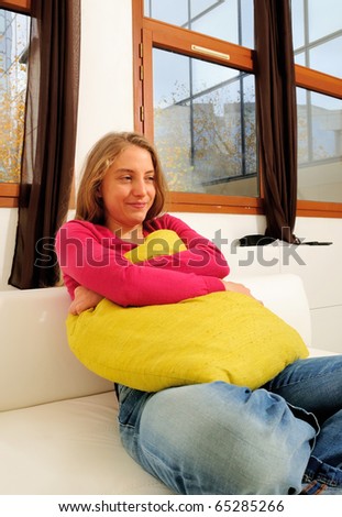 beautiful young woman on the couch in the living room